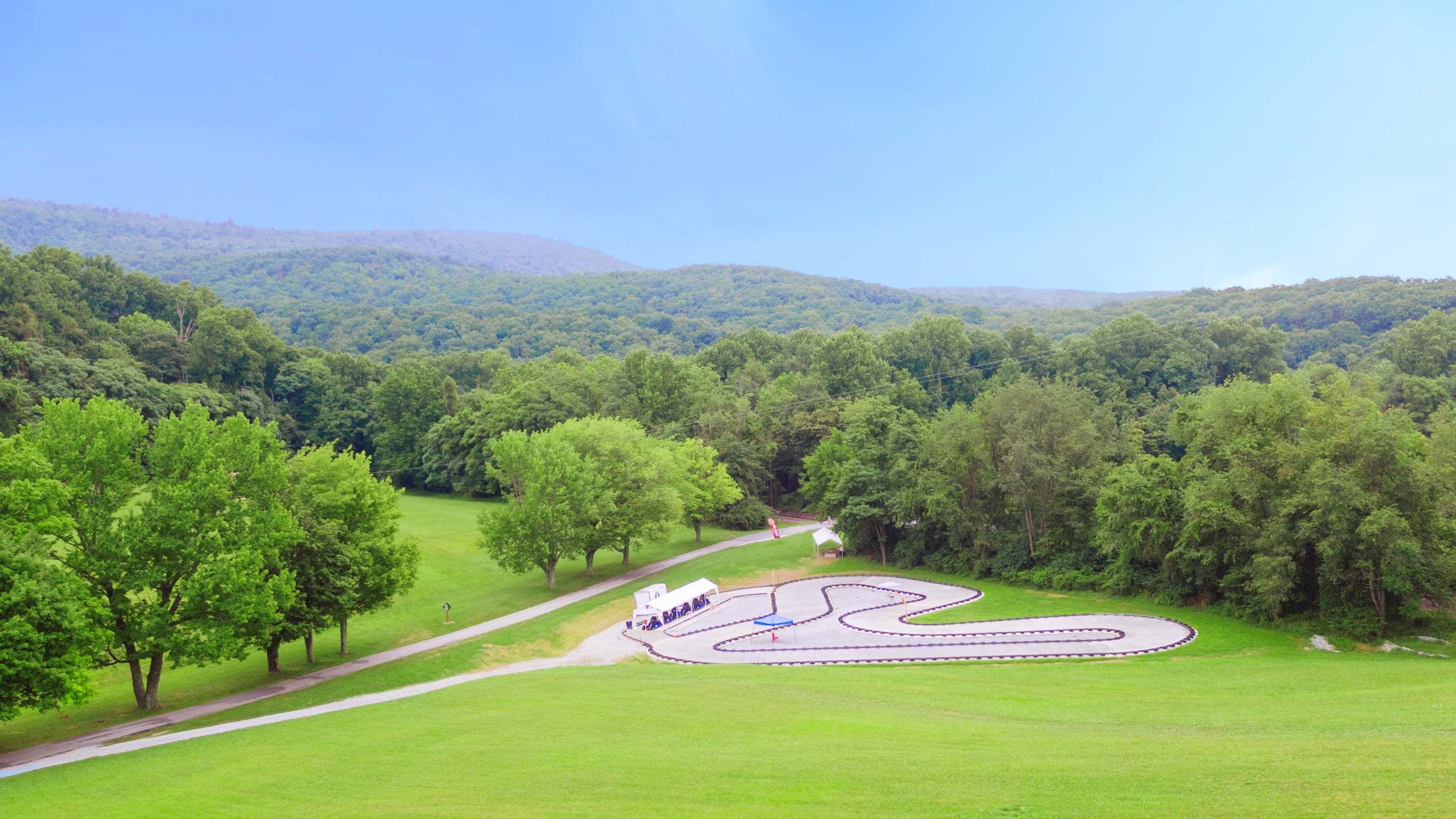 Camp Airy go-kart track by mountains