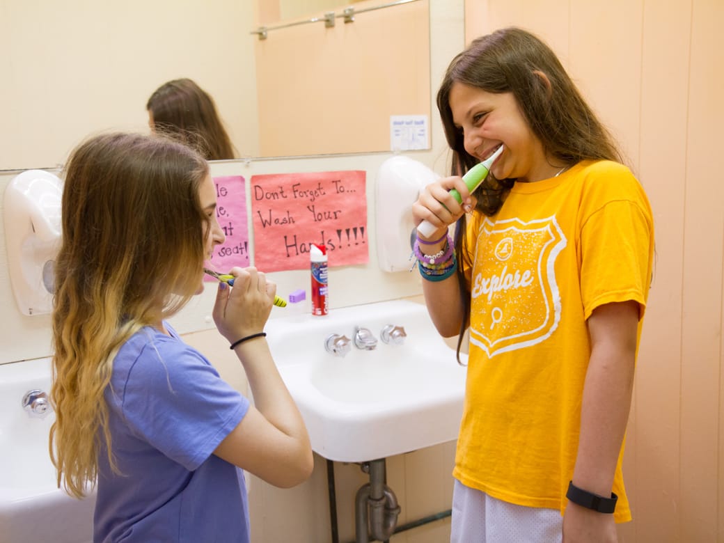 Louise campers brushing their teeth