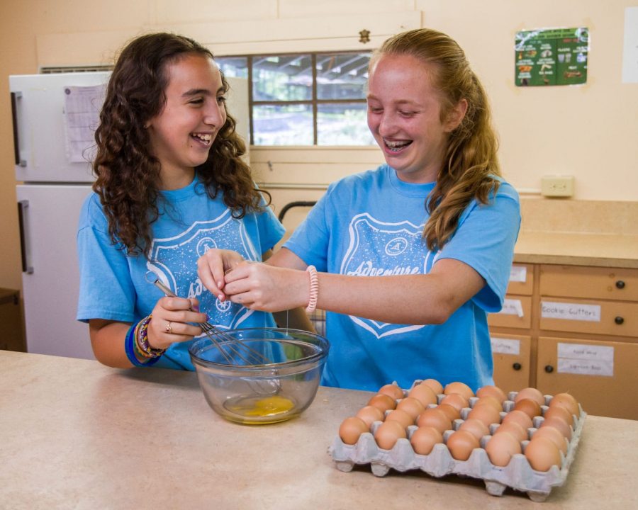 Girls cooking wearing Louise shirts