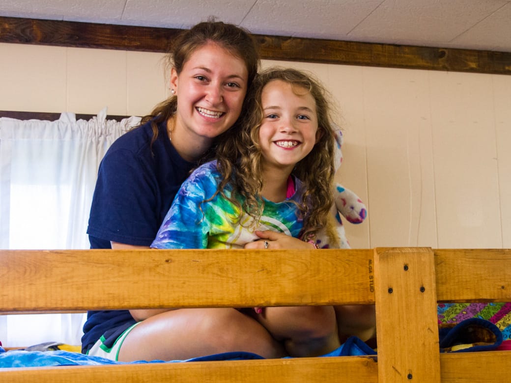 Louise counselor and camper in a bunk