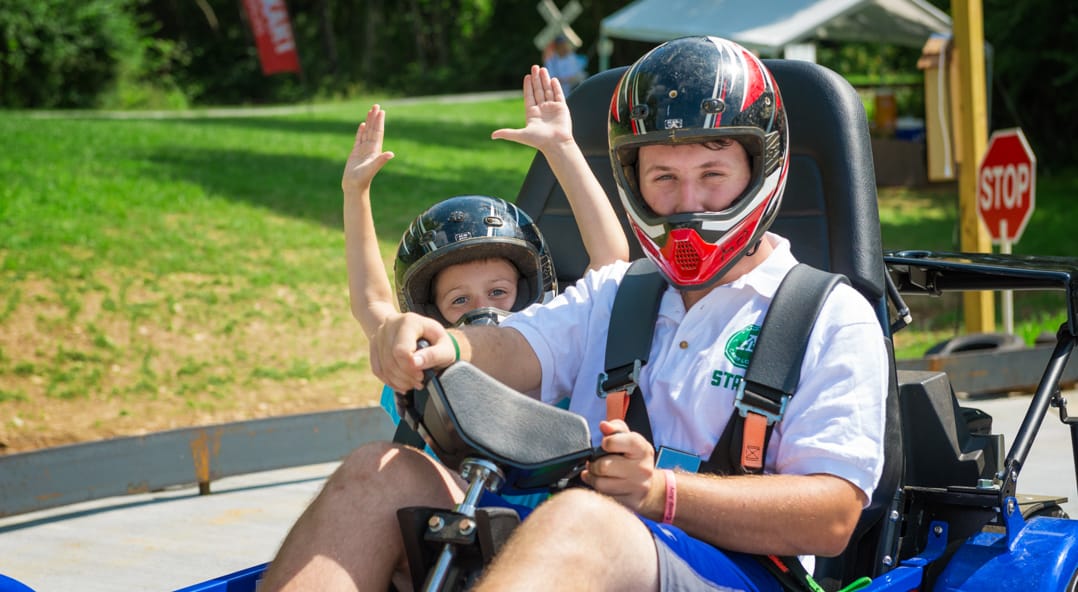 Airy campers driving a go kart