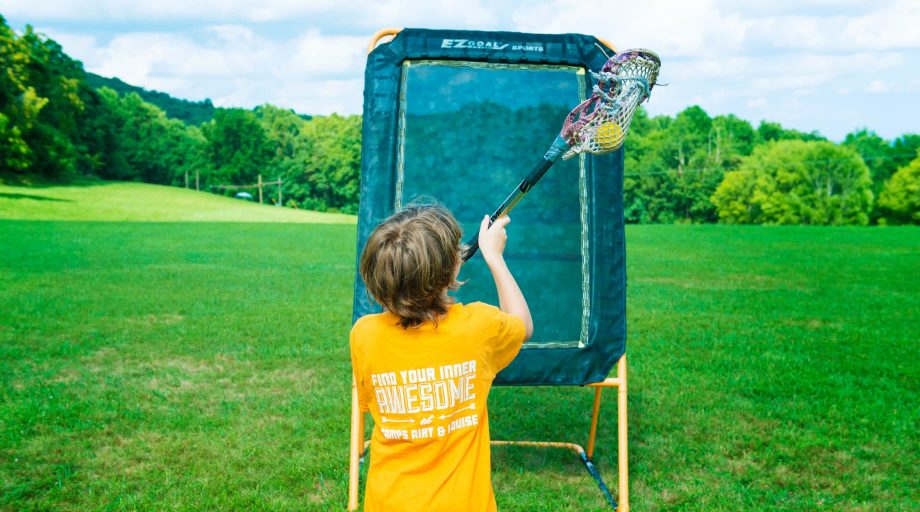 Camper playing lacrosse