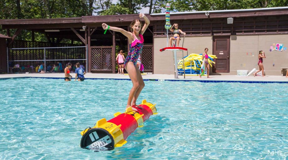 Camper log rolling in pool