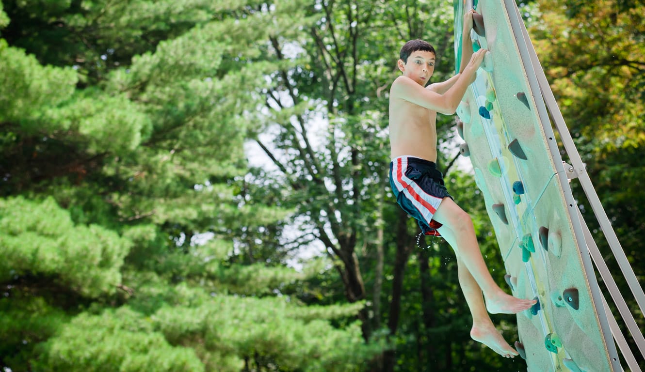 Camper on Airy pool climbing wall