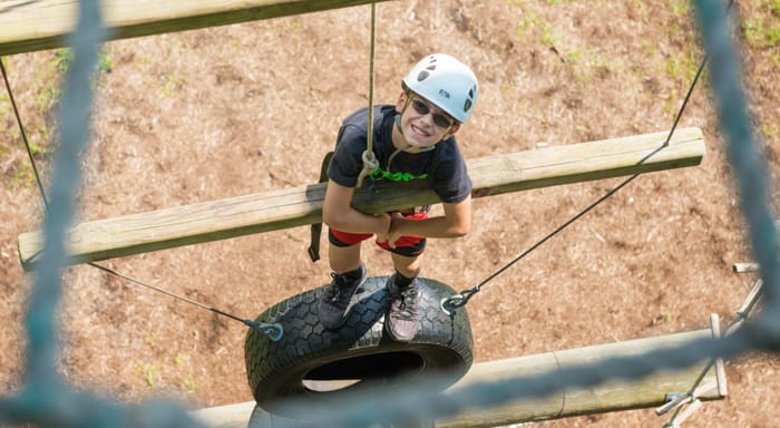 Camper on ropes course