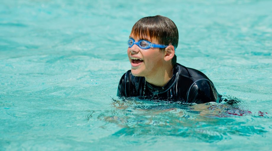 Airy camper swimming in pool