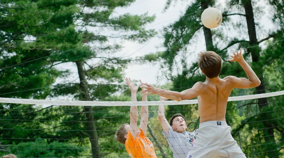 Campers playing volleyball